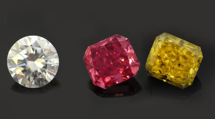 pink-and-yellow-diamonds-next-to-a-colorless-round-diamond 2614.01161
